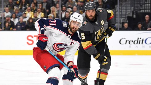 Feb 9, 2019; Las Vegas, NV, USA; Vegas Golden Knights defenseman Deryk Engelland (5) covers Columbus Blue Jackets left wing Nick Foligno (71) during the third period at T-Mobile Arena.