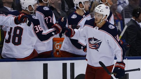 Oct 21, 2019; Toronto, Ontario, CAN; Columbus Blue Jackets forward Alexander Wennberg (10) gets congratuated after scoring the tying goal against the Toronto Maple Leafs at Scotiabank Arena. Columbus defeated Toronto in overtime. Mandatory Credit: John E. Sokolowski-USA TODAY Sports