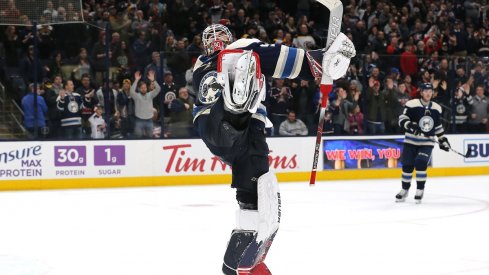  Elvis Merzlikins celebrates his first career home shutout at Nationwide Arena