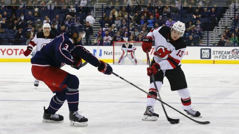 Columbus, OH, USA; Columbus Blue Jackets defenseman Seth Jones (3) defends against New Jersey Devils center Nico Hischier (13) during the third period at Nationwide Arena.