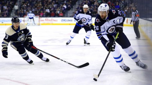 Mar 3, 2019; Columbus, OH, USA; Winnipeg Jets right wing Blake Wheeler (26) skates with the puck against the Columbus Blue Jackets in the first period at Nationwide Arena.