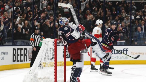 Columbus Blue Jackets goalie Elvis Merzlikins (90) celebrates his first NHL win against the Florida Panthers after the game at Nationwide Arena.