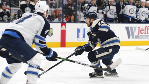 an 22, 2020; Columbus, Ohio, USA; Columbus Blue Jackets right wing Oliver Bjorkstrand (28) passes the puck against the Winnipeg Jets during the second period at Nationwide Arena.