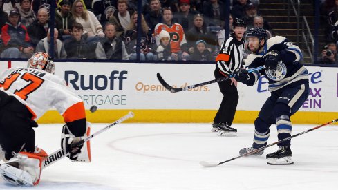 Nov 27, 2019; Columbus, OH, USA; Philadelphia Flyers goalie Brian Elliott (37) makes a save against Columbus Blue Jackets right wing Oliver Bjorkstrand (28) during the second period at Nationwide Arena.