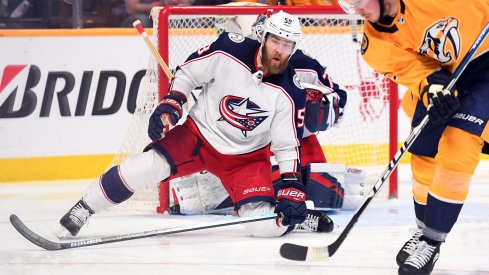 Mar 30, 2019; Nashville, TN, USA; Columbus Blue Jackets defenseman David Savard (58) drops to the ice to defend a shot from Nashville Predators center Ryan Johansen (92) during the second period at Bridgestone Arena.