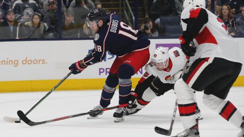 Nov 25, 2019; Columbus, OH, USA; Columbus Blue Jackets center Pierre-Luc Dubois (18) carries the puck as Ottawa Senators right wing Mikkel Boedker (89) tries to poke check during the second period at Nationwide Arena.