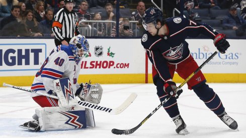 New York Rangers goalie Alexandar Georgiev (40) makes a save against Columbus Blue Jackets right wing Josh Anderson (77) during the first period at Nationwide Arena