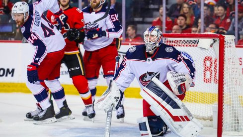 Joonas Korpisalo looks on in 3-2 OTL against Calgary Flames