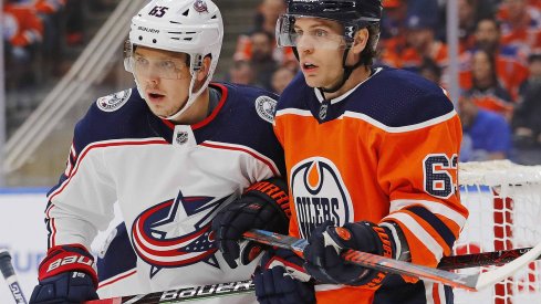 Columbus Blue Jackets defensemen Markus Nutivaara (65) and Edmonton Oilers forward Tyler Ennis (63) battle for position during the first period at Rogers Place.