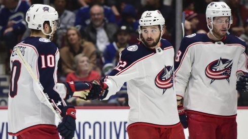 Mar 8, 2020; Vancouver, British Columbia, CAN; Columbus Blue Jackets forward Emil Bemstrom (52) celebrates his goal against Vancouver Canucks goaltender Thatcher Demko (35) (not pictured) with Columbus Blue Jackets forward Alexander Wennberg (10) during the second period at Rogers Arena. Mandatory Credit: Anne-Marie Sorvin-USA TODAY Sports