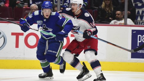 Mar 8, 2020; Vancouver, British Columbia, CAN; Vancouver Canucks defenseman Troy Stecher (51) skates against Columbus Blue Jackets forward Gustav Nyquist (14) during the second period at Rogers Arena.