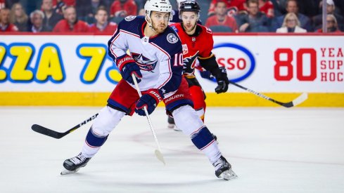 Alexander Wennberg controls the puck against the Calgary Flames during overtime