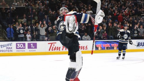 Jan 14, 2020; Columbus, Ohio, USA; Columbus Blue Jackets goalie Elvis Merzlikins (90) celebrates the win after the game with the Boston Bruins at Nationwide Arena.