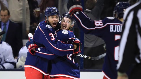 Columbus Blue Jackets defenseman Seth Jones (3) celebrates the goal scored by center Alexandre Texier (right) against the Tampa Bay Lightning in the first period during game four of the first round of the 2019 Stanley Cup Playoffs at Nationwide Arena.