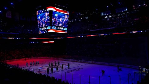 The starters for the Toronto Maple Leafs and the Columbus Blue Jackets stand on the ice for the American National Anthem prior to the game at Nationwide Arena.