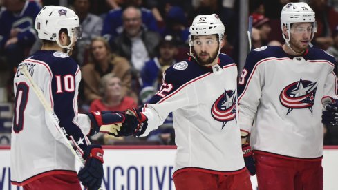 Mar 8, 2020; Vancouver, British Columbia, CAN; Columbus Blue Jackets forward Emil Bemstrom (52) celebrates his goal against Vancouver Canucks goaltender Thatcher Demko (35) (not pictured) with Columbus Blue Jackets forward Alexander Wennberg (10) during the second period at Rogers Arena.