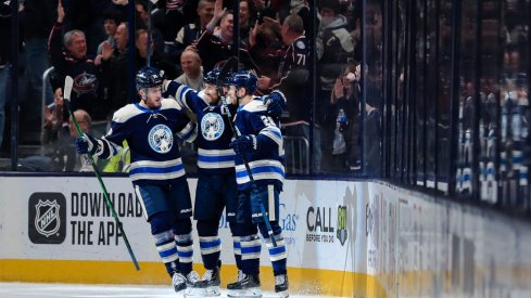 Columbus Blue Jackets left wing Nick Foligno (middle) celebrates with teammate center Pierre-Luc Dubois (left) and right wing Oliver Bjorkstrand (right) after scoring a goal against the Philadelphia Flyers in the first period at Nationwide Arena.