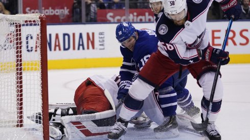 David Savard clears a rebound away from Andreas Johnsson