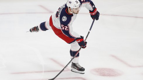 Columbus Blue Jackets center Emil Bemstrom (52) shoots against the Chicago Blackhawks during the first period at United Center.