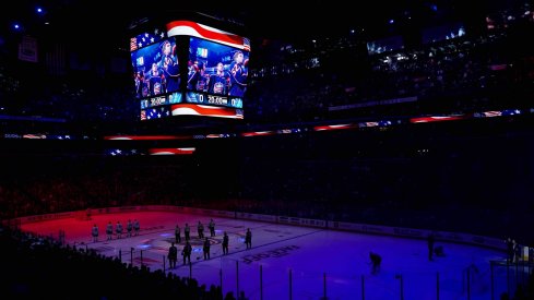 The starters for the Toronto Maple Leafs and the Columbus Blue Jackets stand on the ice for the American National Anthem prior to the game at Nationwide Arena.