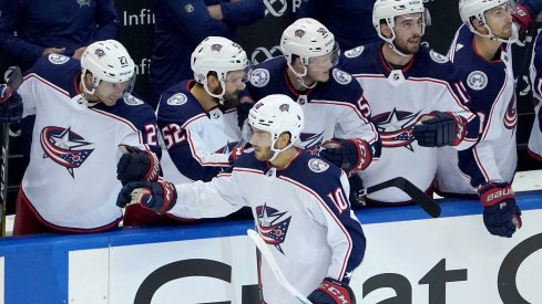 Aug 2, 2020; Toronto, Ontario, CANADA; Alexander Wennberg #10 of the Columbus Blue Jackets celebrates his empty net goal with teammates on the bench in the third period against the Toronto Maple Leafs in Game One of the Eastern Conference Qualification Round prior to the 2020 NHL Stanley Cup Playoffs at Scotiabank Arena on August 02, 2020 in Toronto, Ontario, Canada.