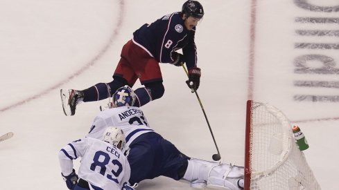 Columbus Blue Jackets defenseman Zach Werenski (8) tries to get a shot on Toronto Maple Leafs goaltender Frederik Andersen (31) during overtime of Eastern Conference qualifications at Scotiabank Arena.