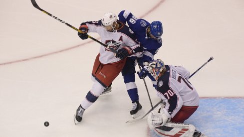 Aug 11, 2020; Toronto, Ontario, CAN; Tampa Bay Lightning right wing Nikita Kucherov (86) and Columbus Blue Jackets defenseman Seth Jones (3) battle for the puck in front of Blue Jackets goaltender Joonas Korpisalo (70) in the first overtime in game one of the first round of the 2020 Stanley Cup Playoffs at Scotiabank Arena.