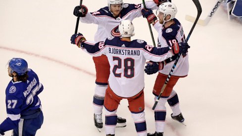 Aug 13, 2020; Toronto, Ontario, CAN; Columbus Blue Jackets right wing Oliver Bjorkstrand (28) celebrates his goal against the Tampa Bay Lightning with teammates during the first period in game two of the first round of the 2020 Stanley Cup Playoffs at Scotiabank Arena.