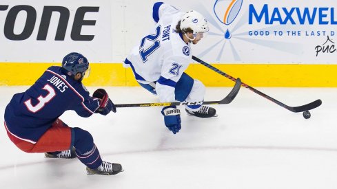 Aug 15, 2020; Toronto, Ontario, CAN; Tampa Bay Lightning center Brayden Point (21) skates with the puck as Columbus Blue Jackets defenseman Seth Jones (3) gives chase during the first period of game three of the first round of the 2020 Stanley Cup Playoffs at Scotiabank Arena.