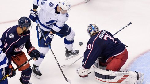 Aug 17, 2020; Toronto, Ontario, CAN; Tampa Bay Lightning left wing Ondrej Palat (18) battles against Columbus Blue Jackets goaltender Joonas Korpisalo (70) in the first period in game four of the first round of the 2020 Stanley Cup Playoffs at Scotiabank Arena.