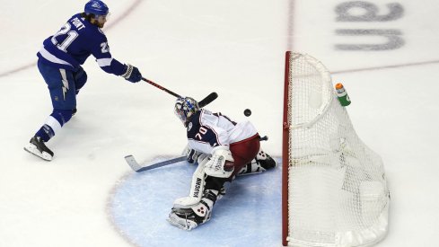 Tampa Bay Lightning center Brayden Point (21) shoots to score a goal against Columbus Blue Jackets goaltender Joonas Korpisalo (70) during the overtime period in game five of the first round of the 2020 Stanley Cup Playoffs at Scotiabank Arena.