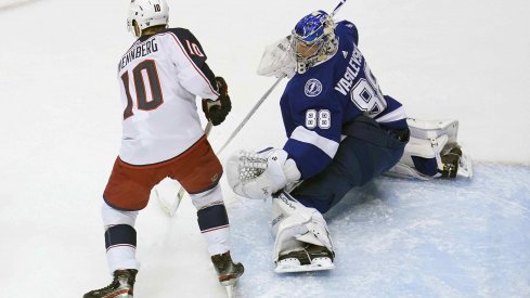 Tampa Bay Lightning goaltender Andrei Vasilevskiy (88) blocks a shot as Columbus Blue Jackets center Alexander Wennberg (10) is in position for the rebound during the first period in game five of the first round of the 2020 Stanley Cup Playoffs at Scotiabank Arena.