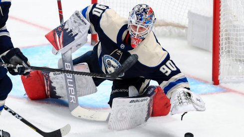 Feb 10, 2020; Columbus, Ohio, USA; Columbus Blue Jackets goaltender Elvis Merzlikins (90) tosses the puck aside after making a save against the Tampa Bay Lightning in the second period at Nationwide Arena.