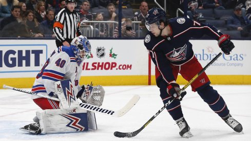 Dec 5, 2019; Columbus, OH, USA; New York Rangers goalie Alexandar Georgiev (40) makes a save against Columbus Blue Jackets right wing Josh Anderson (77) during the first period at Nationwide Arena.