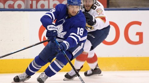 Feb 3, 2020; Toronto, Ontario, CAN; Toronto Maple Leafs forward Andreas Johnsson (18) cuts past Florida Panthers forward Mike Hoffman (68) in the second period at Scotiabank Arena.
