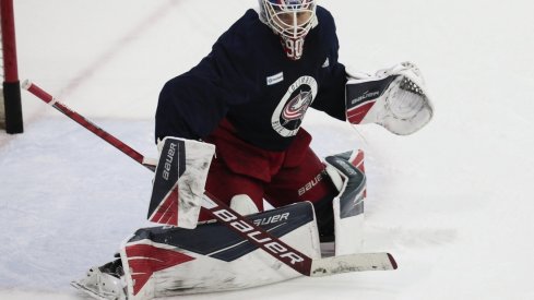 Elvis Merzlikins, getting some work in during practice Monday, excelled in goal after a rocky start filling in for the injured Joonas Korpisalo.