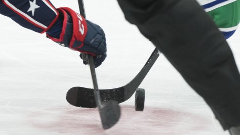 A detail view of a second period face off between the Columbus Blue Jackets and Vancouver Canucks at Nationwide Arena. 