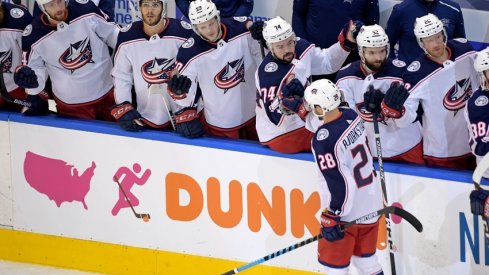 Columbus Blue Jackets right wing Oliver Bjorkstrand (28) celebrates his goal against the Tampa Bay Lightning with teammates during the first period in game two of the first round of the 2020 Stanley Cup Playoffs at Scotiabank Arena. 