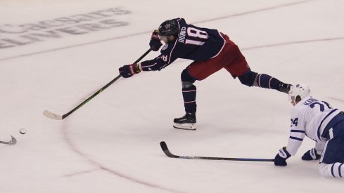 Columbus Blue Jackets forward Pierre-Luc Dubois (18) scores on this shot as Toronto Maple Leafs forward Kasperi Kapanen (24) looks on during the third period of Eastern Conference qualifications at Scotiabank Arena.