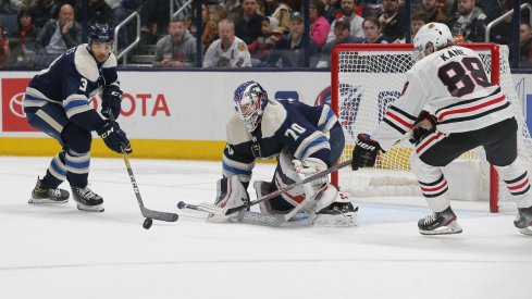 Columbus Blue Jackets defenseman Seth Jones (3) sticks the rebound away from Chicago Blackhawks right wing Patrick Kane (88) during the second period at Nationwide Arena