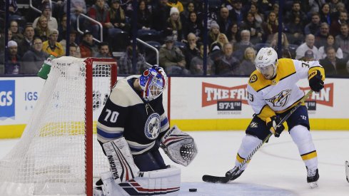 Jan 10, 2019; Columbus, OH, USA; Columbus Blue Jackets goalie Joonas Korpisalo (70) makes a save as Nashville Predators right wing Viktor Arvidsson (33) looks for the rebound during the third period at Nationwide Arena.