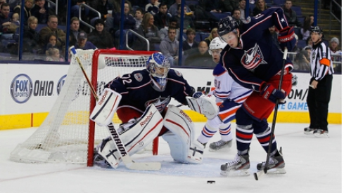 Former Blue Jacket Ryan Johansen clears the puck in front of former Blue Jacket Sergei Bobrovsky. 