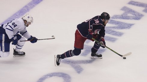 Columbus Blue Jackets forward Pierre-Luc Dubois (18) gets past Toronto Maple Leafs defenseman Morgan Rielly (44) to score the winning goal during overtime of Eastern Conference qualifications at Scotiabank Arena