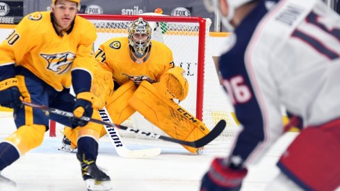 Nashville Predators goaltender Juuse Saros (74) waits for a shot from Max Domi (16) during the second period at Bridgestone Arena. 