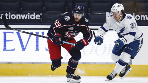 Columbus Blue Jackets right wing Oliver Bjorkstrand (28) skates against Tampa Bay Lightning center Yanni Gourde (37) in the first period at Nationwide Arena.