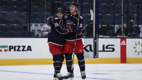 Columbus Blue Jackets center Max Domi (16) celebrates with teammates defenseman Zach Werenski (8) after scoring a goal against the Florida Panthers in the third period at Nationwide Arena.