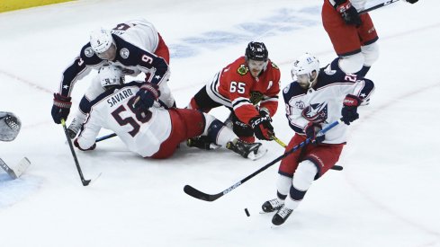 Jan 29, 2021; Chicago, Illinois, USA; Columbus Blue Jackets right wing Oliver Bjorkstrand (28) gets control of the puck against the Chicago Blackhawks during the first period at United Center.