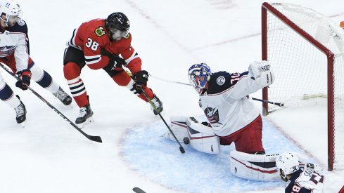 Joonas Korpisalo with one of several key saves Friday night against the Chicago Blackhawks.