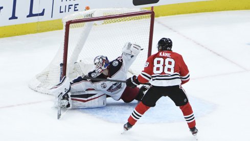 Columbus Blue Jackets goaltender Joonas Korpisalo (70) makes qa save on Chicago Blackhawks right wing Patrick Kane (88) during the third period at United Center.