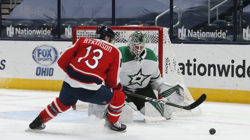 Columbus Blue Jackets right wing Cam Atkinson (13) looks for the rebound of a Dallas Stars goalie Colton Point (32) save during the first period at Nationwide Arena.